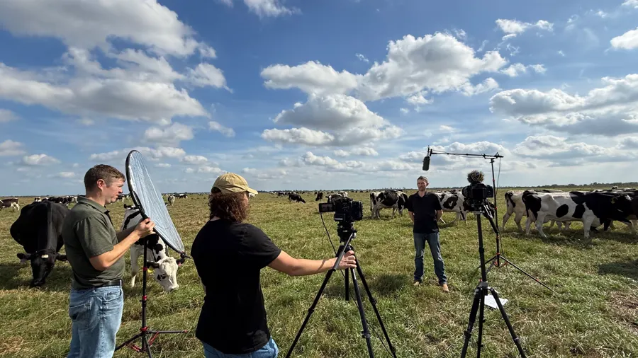 A film crew sets up in a pasture with dairy cattle for the a2 Milk Company segment in Zolfo Springs, Florida