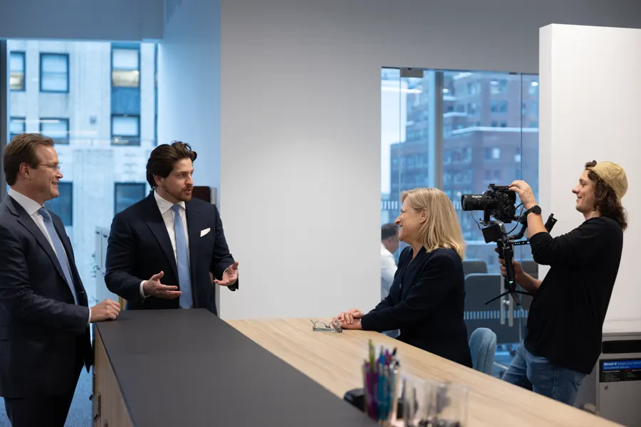 A consultant explains executive pay on camera at F.W. Cook