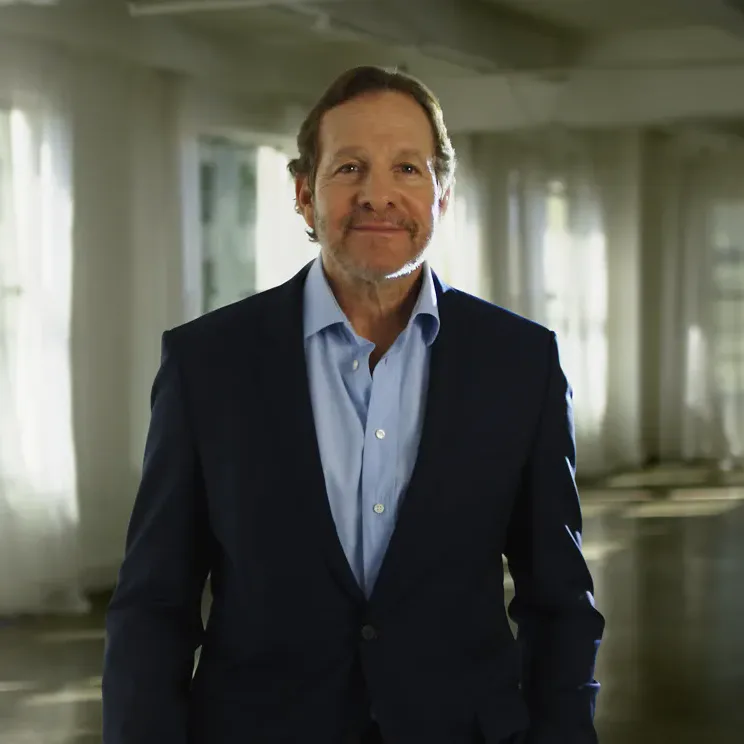 Steve Guttenberg, host of Now We Know TV!, in a sunlit studio loft