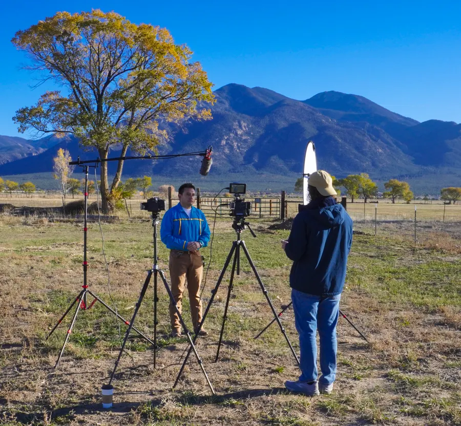 An outdoor product shoot for Taos Footwear with mountains in the background